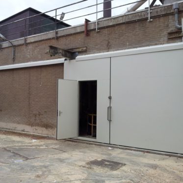 Acoustic door for a paper factory